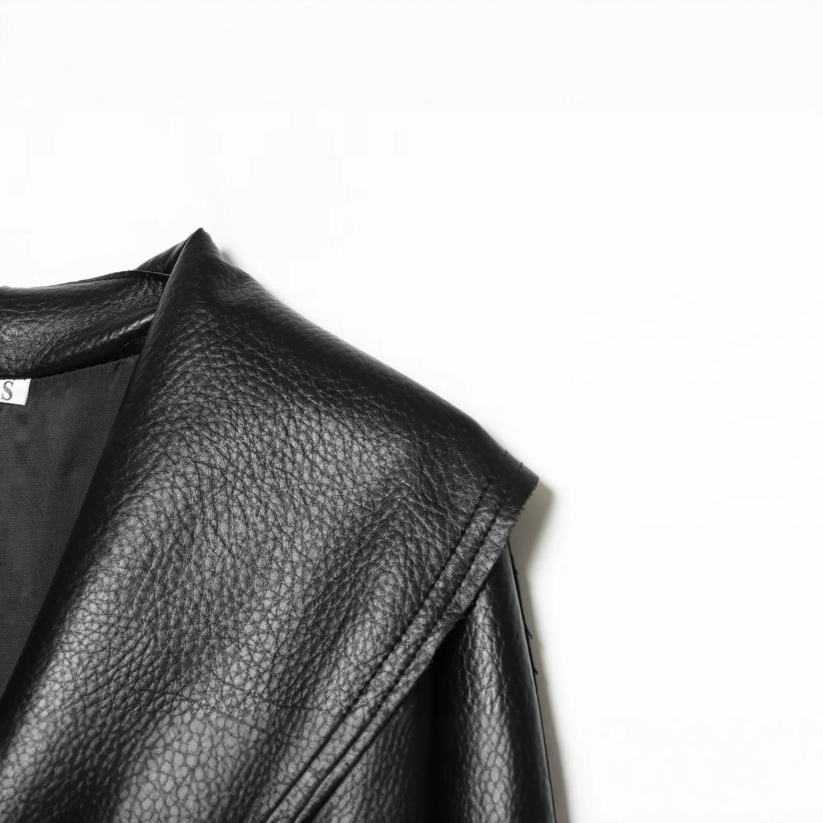 Loose one piece buckle lapel PU leather jacket for women